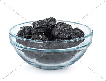 Some prunes in plate isolated on white