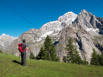 Hiker admiring mountain landscape around Mont Blanc, Courmayer