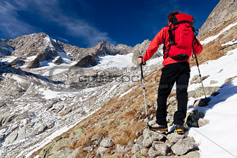 Hiker observing a high mountain panorama