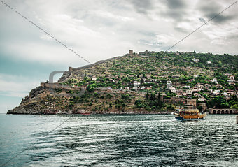 Beautiful landscape with sea, ship and Alanya Castle. Turkey