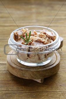 canned tuna with rosemary in a glass jar