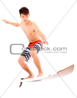 young surfer practice surfing pose  