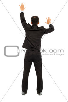   young business man climbing a white wall