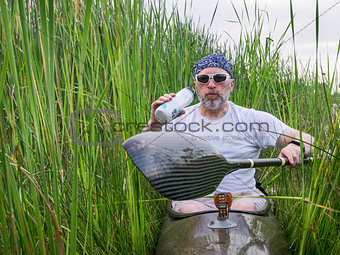 tired kayak paddler drinking