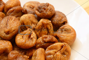 Soft dried figs on a white plate
