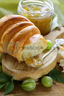 Breakfast croissant with fresh jam of green gooseberry