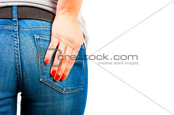 woman's hand with red nails in his pocket jeans