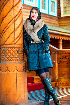 girl in a leather coat and painted scarf
