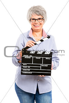 Elderly woman holding a clapboard