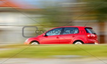 Fast moving red car