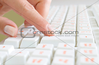 Close-up of typing hands on keyboard