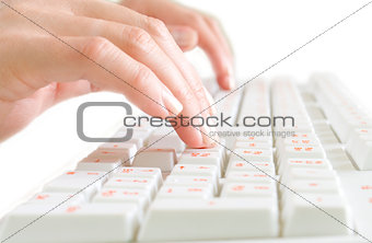 Close-up of typing hands on keyboard
