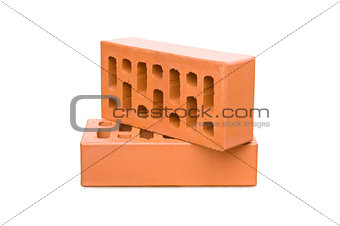 Stack of old red bricks isolated on white background