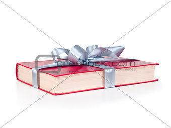 Book wrapped with a ribbon