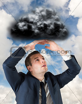 Composite image of businessman standing with hands over head