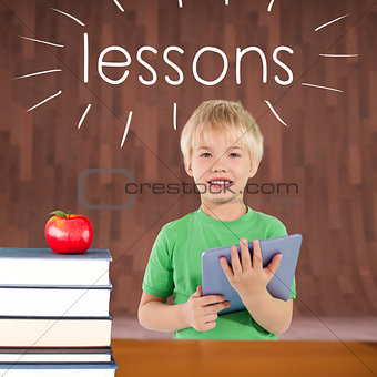 Lessons against red apple on pile of books