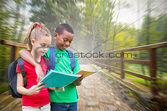 Composite image of cute pupils reading