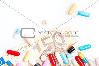 medical pills over fifty euro banknote