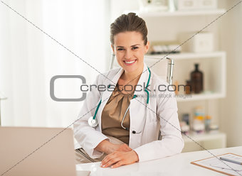 Portrait of smiling doctor woman in office
