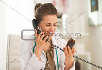 Doctor woman with medicine bottle talking phone
