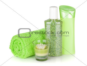 Bathroom bottles, towel and candle