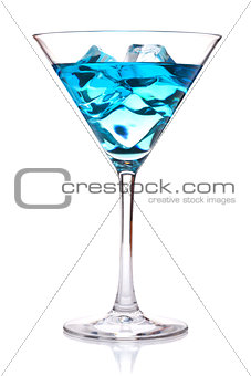 Blue tropical cocktail in martini glass