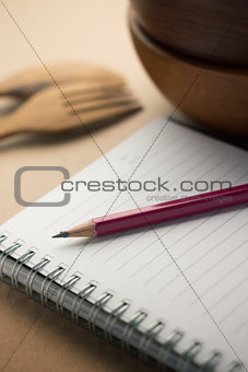 pencil laying on the notebook