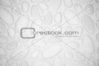 textured stone wall background with small stones and cement 