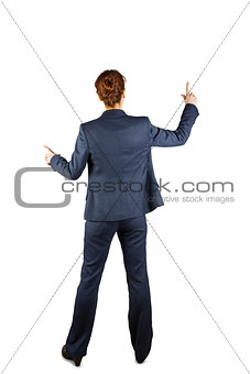 Businesswoman in suit pointing fingers