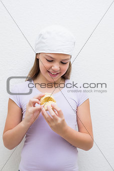 Little girl holding model teeth