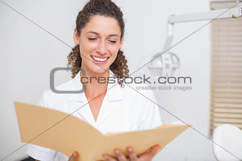 Dental assistant reading from file