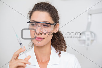 Dental assistant preparing an injection