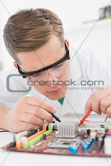 Technician working on broken cpu with soldering iron