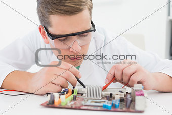 Technician working on broken cpu with soldering iron