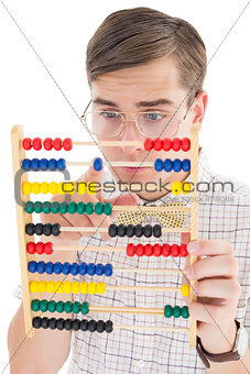Nerdy hipster adding on abacus