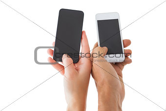 Couples hands holding smartphones