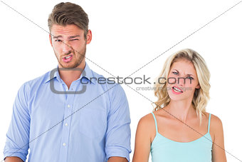 Young couple making silly faces