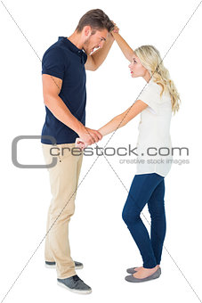 Angry man overpowering his girlfriend