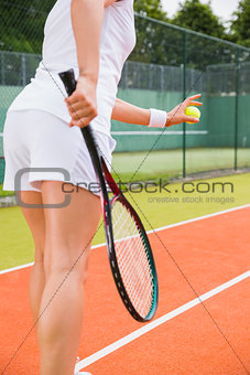 Tennis player getting ready to serve