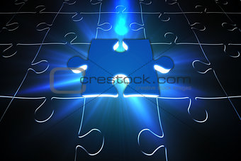 Blue glowing jigsaw piece on puzzle