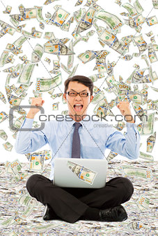 business man make a victory gesture with money rain