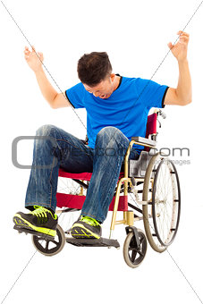 depressed and angry man sitting on a wheelchair