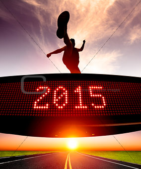 happy new year 2015.runner jumping and crossing over matrix 