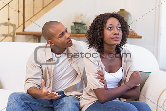 Unhappy woman not listening to his excuses