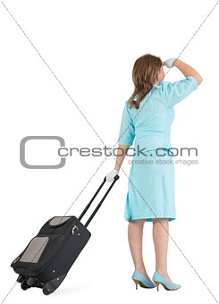 Stewardess in blue uniform with her bag