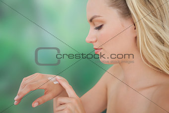 Beautiful natural blonde rubbing in hand cream