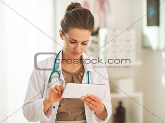 Doctor woman using tablet pc in office