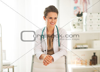 Portrait of happy doctor woman in office