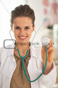 Portrait of doctor woman using stethoscope