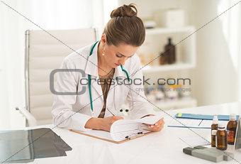 Doctor woman working in office